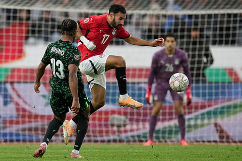 Egypt's Mohanad Lasheen is challenged by Nigeria's Bruno Onyemaechi during the Africa Cup of Nations third place game between Egypt and Nigeria in Casablanca, Morocco.