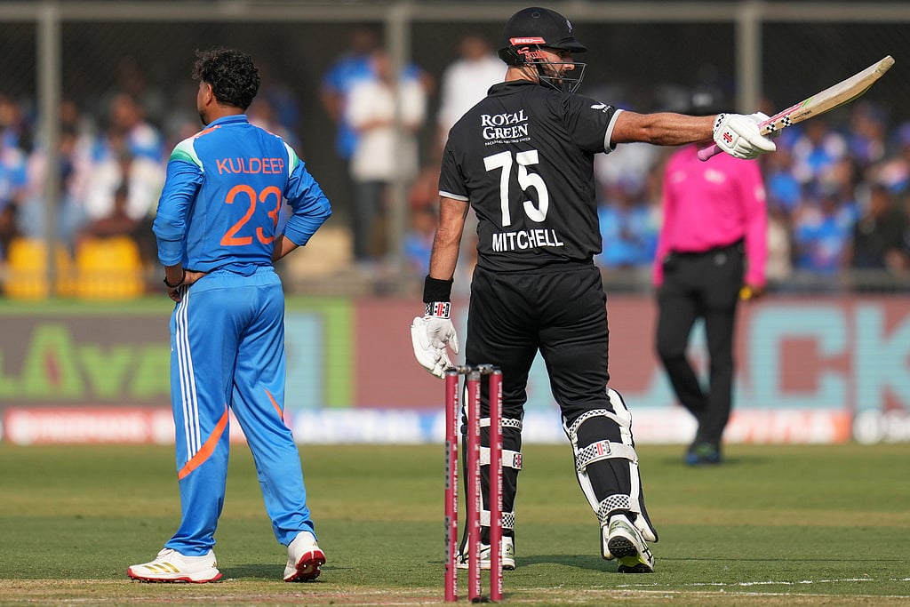 New Zealands Daryl Mitchell, right, celebrates his fifty runs