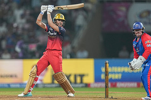 Royal Challengers Bengaluru's captain Smriti Mandhana plays a shot during the Women's Premier League (WPL) T20 cricket match between Royal Challengers Bengaluru and Delhi Capitals, at the DY Patil Stadium, in Navi Mumbai.