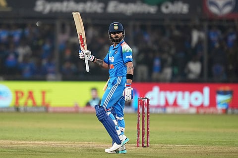 India's Virat Kohli celebrates his century during the third One Day International cricket match between India and New Zealand in Indore, India.