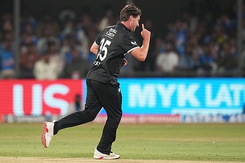 New Zealand's Zak Foulkes celebrates the wicket of India's Rohit Sharma during the third One Day International cricket match between India and New Zealand in Indore, India.