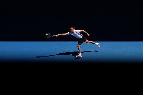 Alexander Zverev of Germany plays a forehand return to Gabriel Diallo of Canada during their first round match at the Australian Open tennis championship in Melbourne, Australia.