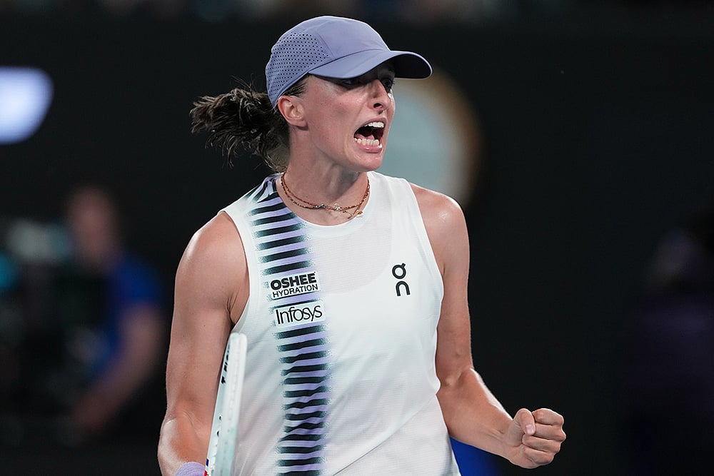 | Photo: AP/Aaron Favila : Iga Swiatek of Poland reacts after defeating Yuan Yue of China in their first round match at the Australian Open tennis championship in Melbourne, Australia.