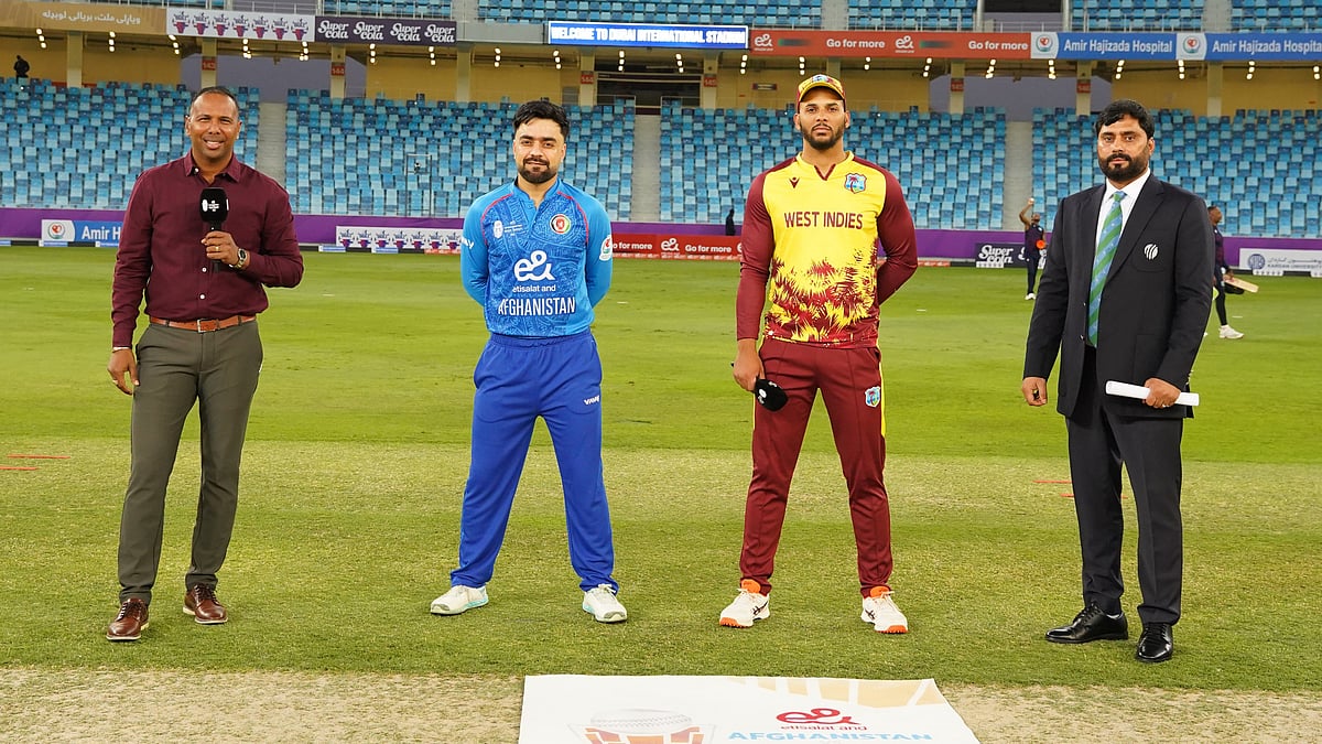 X/Afghanistan Cricket Board : Captains Rashid Khan and Brandon King at the toss for the first T20 international between Afghanistan and West Indies in Dubai.