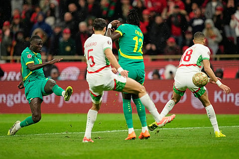 Senegal's Pape Gueye scores the opening goal during the Africa Cup of Nations final soccer match between Senegal and Morocco, in Rabat, Morocco.