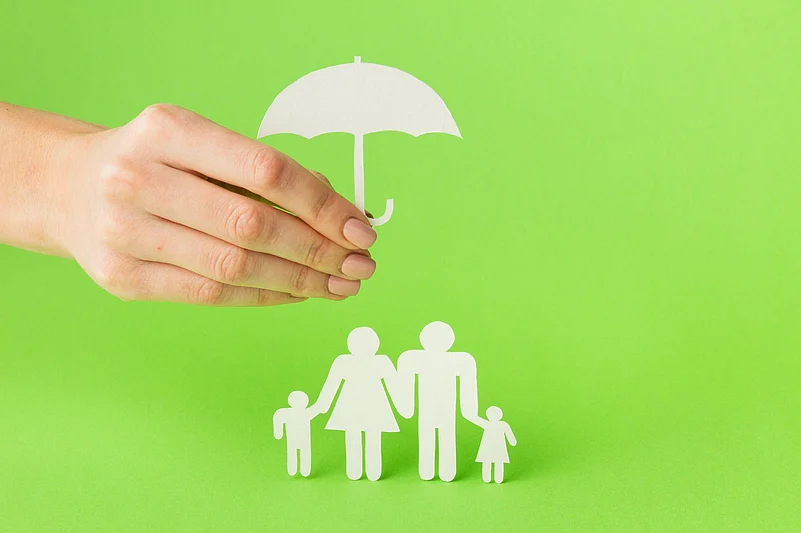 Insurance and family protection concept (paper cutouts)