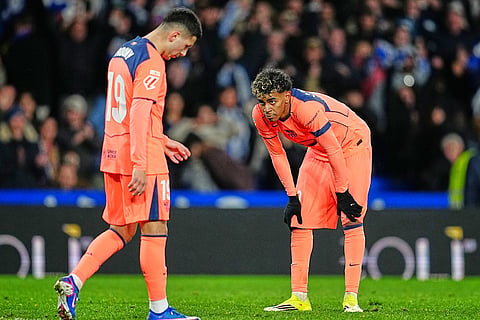 Barcelona's Roony Bardghji, left, and Barcelona's Lamine Yamal react during the Spanish La Liga soccer match between Real Sociedad and Barcelona in San Sebastian, Spain.