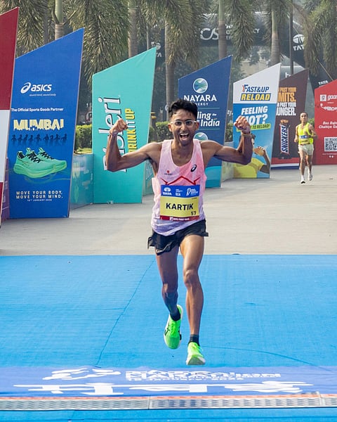 Indian elite men’s winner Kartik Karkera at the finish line