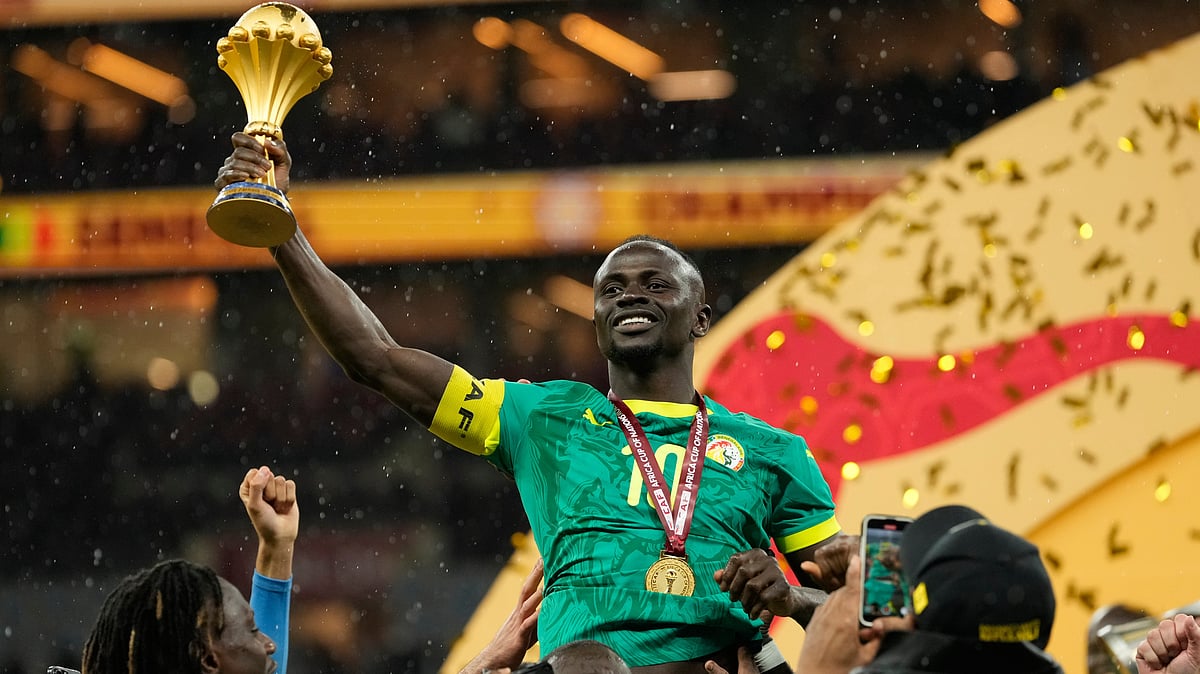 | Photo: AP/Mosa'ab Elshamy : Senegal's Sadio Mane holds the trophy aloft after winning the Africa Cup of Nations final soccer match agaisnt Morocco, in Rabat, Morocco, Sunday, Jan. 18, 2026.