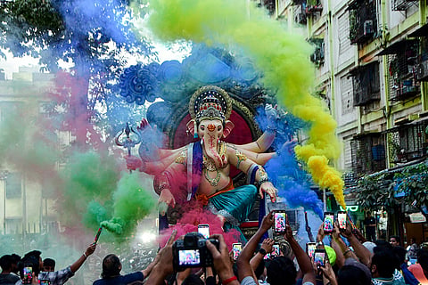 Devotees carry an idol of Lord Ganesh ahead of the ‘Maghi Ganpati’ festival, in Mumbai.