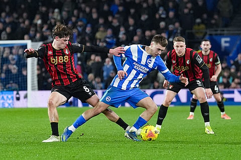 Bournemouth's Alex Scott and Brighton and Hove Albion's Brajan Gruda, right, battle for the ball during the English Premier League match between Brighton & Hove Albion and AFC Bournemouth in Brighton and Hove, England.