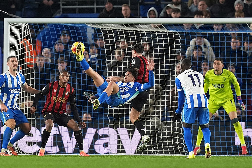 | Photo: Gareth Fuller/PA via AP : Brighton and Hove Albion's Charalampos Kostoulas scores his side's first goal during the English Premier League match between Brighton & Hove Albion and AFC Bournemouth in Brighton and Hove, England.