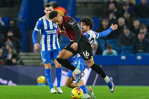 Bournemouth's Marcus Tavernier and Brighton and Hove Albion's Ferdi Kadioglu battle for the ball during the English Premier League match between Brighton & Hove Albion and AFC Bournemouth in Brighton and Hove, England.
