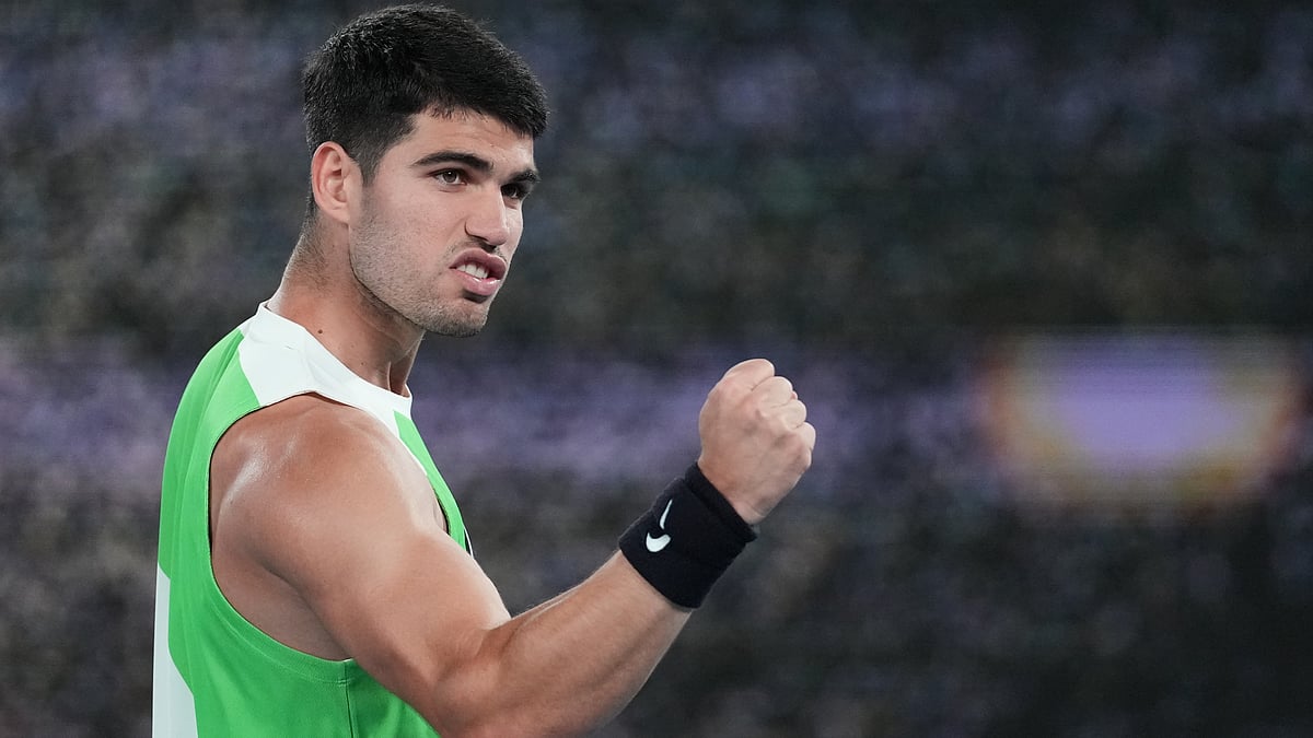 AP/Dita Alangkara : Carlos Alcaraz of Spain celebrates after defeating Adam Walton of Australia in their first round match at the Australian Open.