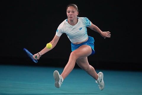 Antonia Ruzic of Croatia plays a forehand return to Naomi Osaka of Japan during their first round match at the Australian Open tennis championship in Melbourne, Australia.