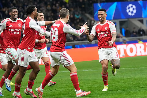 Arsenal's Gabriel Jesus, right, celebrates with his teammates after scoring his side's second goal during the Champions League opening phase soccer match between Inter Milan and Arsenal in Milan, Italy.