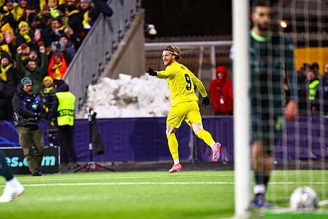 Glimt's Kasper Hogh celebrates after scoring during the Champions League soccer match between Bodo/Glimt and Manchester City in Bodo, Norway.
