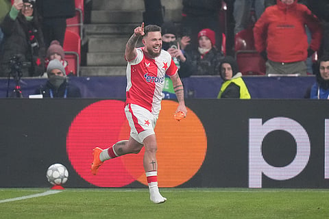 Slavia's Vasil Kusej celebrates after scoring his side's opening goal during the Champions League opening phase soccer match between Slavia Prague and Barcelona in Prague, Czech Republic.