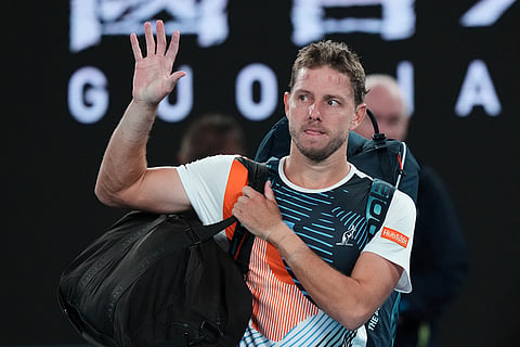 James Duckworth of Australia waves as he leaves the court following his second round loss to Jannik Sinner of Italy at the Australian Open tennis championship in Melbourne, Australia.