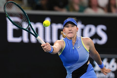 Mirra Andreeva of Russia plays a forehand return to Maria Sakkari of Greece during their second round match at the Australian Open tennis championship in Melbourne, Australia.