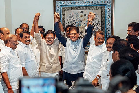 Union Minister Piyush Goyal, centre, raises hands with Amma Makkal Munnetra Kazhagam (AMMK) President TTV Dhinakaran as he joins the NDA alliance, in the presence of Minister of State L Murugan, BJP National Women's Wing President Vanathi Srinivasan, MLA M R Gandhi and BJP leader Nainar Nagenthran, in Chennai. 