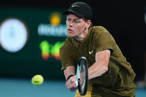 Jannik Sinner of Italy plays a backhand return to James Duckworth of Australia during their second round match at the Australian Open tennis championship in Melbourne, Australia.