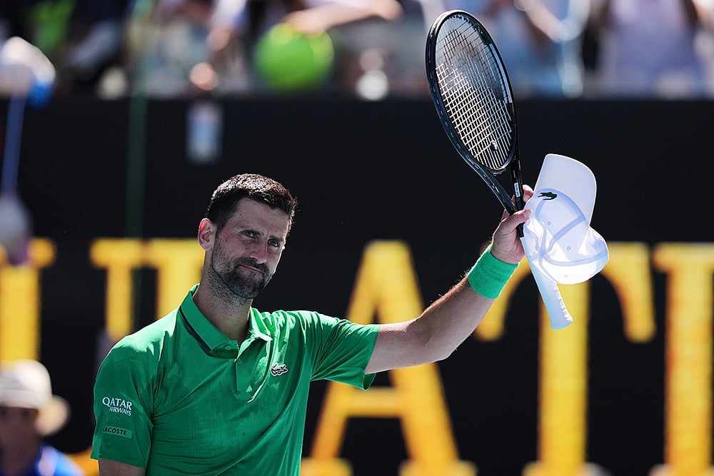 | Photo: AP/Aaron Favila : Novak Djokovic of Serbia waves after defeating Francesco Maestrelli of Italy in their second round match at the Australian Open tennis championship in Melbourne, Australia.