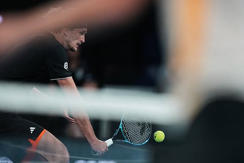Alexander Zverev of Germany plays a backhand return to Alexandre Muller of France during their second round match at the Australian Open tennis championship in Melbourne, Australia.