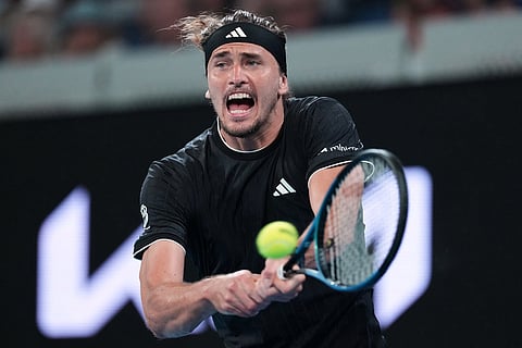 Alexander Zverev of Germany plays a backhand return to Alexandre Muller of France during their second round match at the Australian Open tennis championship in Melbourne, Australia.