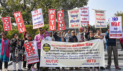 AIUTUC and WFTU activists hold a protest against recent US military strikes in Venezuela, in Patna.