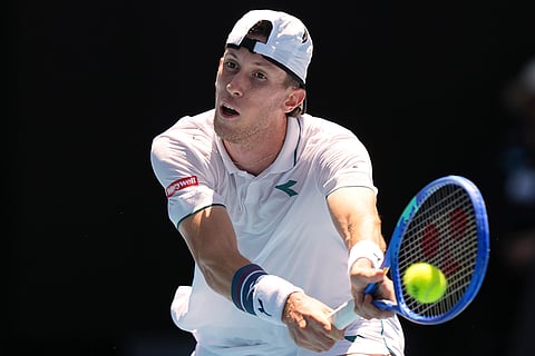Francesco Maestrelli of Italy plays a backhand return to Novak Djokovic of Serbia during their second round match at the Australian Open tennis championship in Melbourne, Australia.