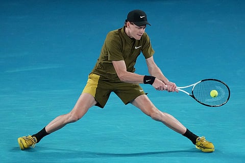 Jannik Sinner of Italy plays a backhand return to James Duckworth of Australia during their second round match at the Australian Open tennis championship in Melbourne, Australia.