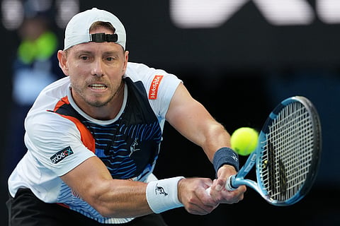 James Duckworth of Australia plays a backhand return to Jannik Sinner of Italy during their second round match at the Australian Open tennis championship in Melbourne, Australia.