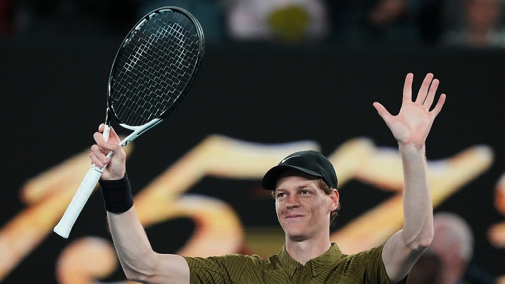 Photo: AP : Jannik Sinner of Italy waves after winning his second round match against James Duckworth of Australia at the Australian Open tennis championship in Melbourne.