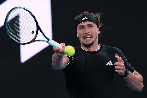 Alexander Zverev of Germany plays a forehand return to Alexandre Muller of France during their second round match at the Australian Open tennis championship in Melbourne, Australia.