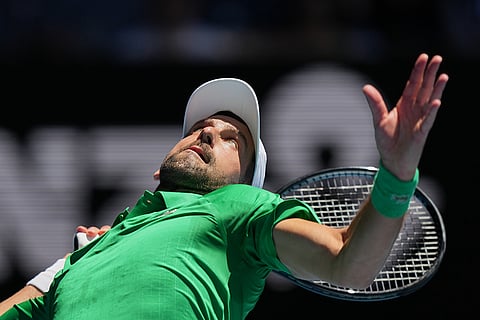 Novak Djokovic of Serbia serves to Francesco Maestrelli of Italy during their second round match at the Australian Open tennis championship in Melbourne, Australia.