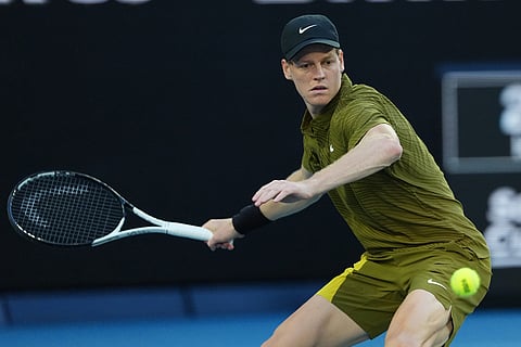 Jannik Sinner of Italy plays a forehand return to James Duckworth of Australia during their second round match at the Australian Open tennis championship in Melbourne, Australia.
