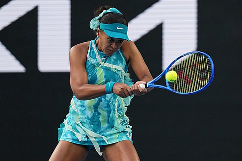 Naomi Osaka of Japan plays a backhand return to Sorana Cirstea of Romania during their second round match at the Australian Open tennis championship in Melbourne, Australia.