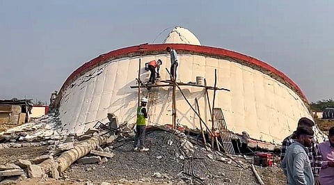 People gather after the collapse of a newly constructed water tank at Tadkeshwar village, Surat district. Surat Rural Police arrested seven people in connection with the collapse. 