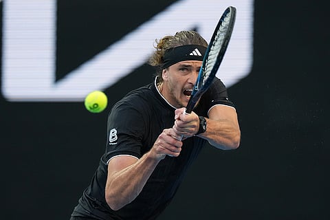 Alexander Zverev of Germany plays a backhand return to Cameron Norrie of Britain during their third round match at the Australian Open tennis championship in Melbourne, Australia.