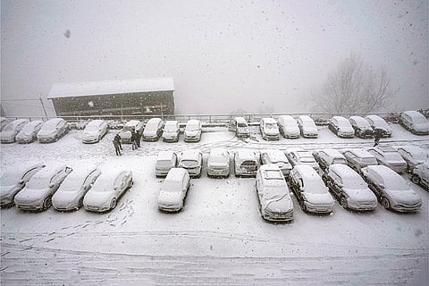 Vehicles lie covered under fresh snowfall in a parking area, in Shimla. The precipitation aligns with forecasts predicting up to 28 cm of snow on January 23, ending the region's dry spell under active western disturbances.