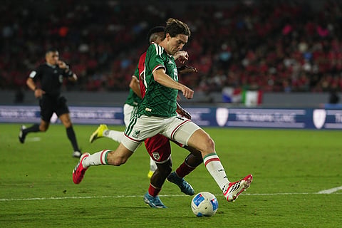 Mexico's Marcel Ruiz protects the ball from Panama's Kevin Galvan during an international friendly soccer match in Panama City.