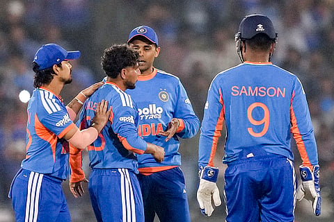 India's Kuldeep Yadav celebrates with teammates after taking the wicket of New Zealand's Glenn Phillips during the second T20I cricket match between India and New Zealand, at Shaheed Veer Narayan Singh International Cricket Stadium, in Raipur, Chhattisgarh.