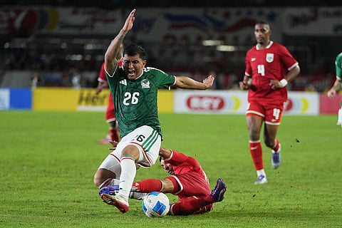 Panama's Omar Cordoba tackles Mexico's Bryan Gonzalez during an international friendly soccer match in Panama City.