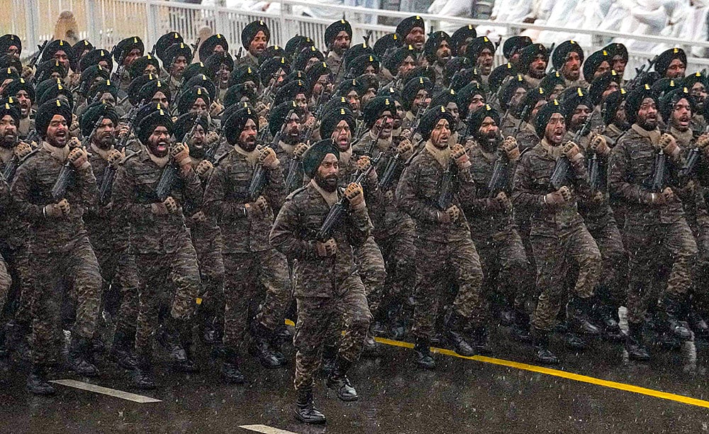 | Photo: PTI/Kamal Kishore : Indian Army contingent marches during rain-affected full-dress rehearsal for the Republic Day Parade, in New Delhi.