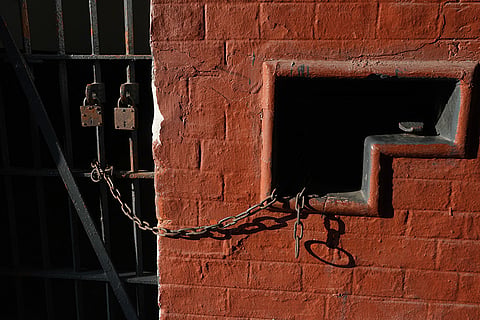 This image displays the entrance to a cell at the Alipore Jail Museum in Kolkata. 