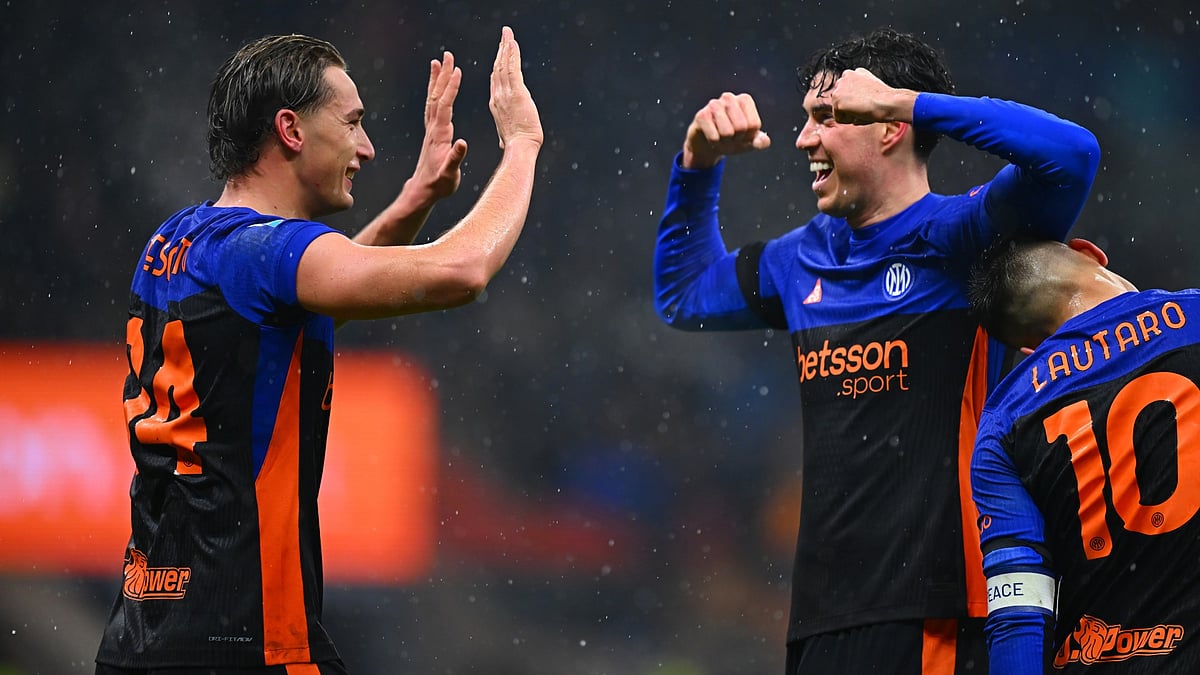 Francesco Esposito and Alessandro Bastoni celebrate Inter's third goal against Pisa