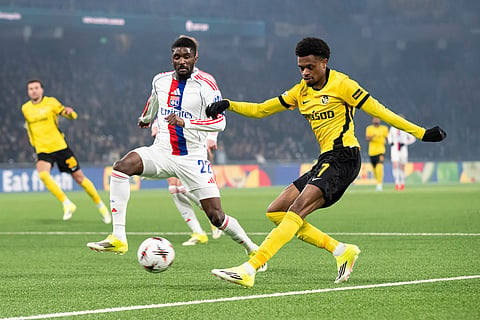Young Boys's Alan Virginius, right, and Lyon's Clinton Mata challenge for the ball during the Europa League opening phase soccer match between Young Boys and Olympique Lyonnais, in Bern, Switzerland.