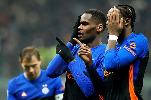 Inter Milan's Ange-Yoan Bonny, center, celebrates with Inter Milan's Marcus Thuram after scoring his side's fifth goal during a Serie A soccer match between Inter Milan and Pisa, in Milan, Italy.