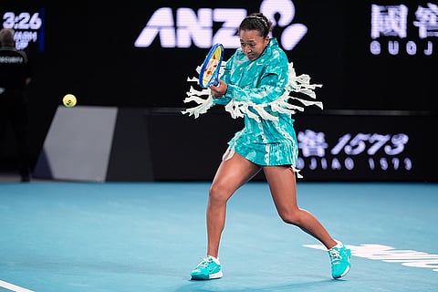 Naomi Osaka of Japan warms up ahead of her first round match against Antonia Ruzic of Croatia at the Australian Open tennis championship in Melbourne, Australia, Tuesday, Jan. 20, 2026. 